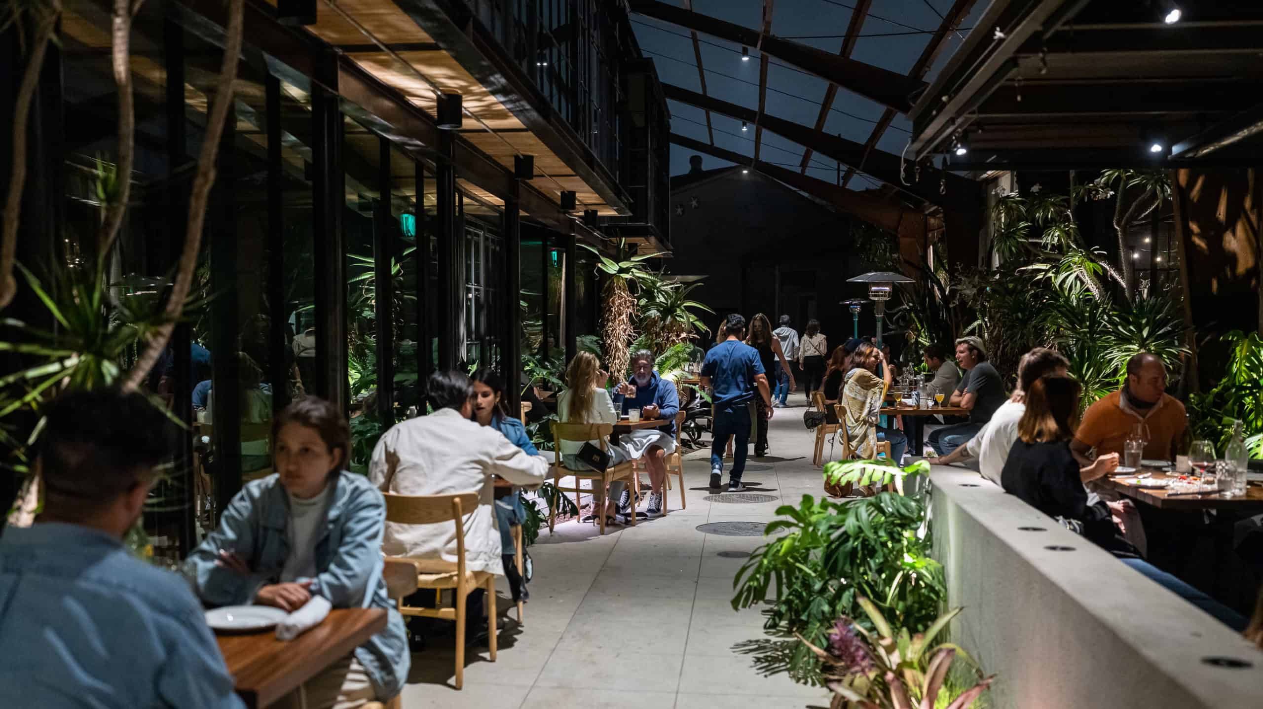 Guests dining on the outdoor patio and corridor