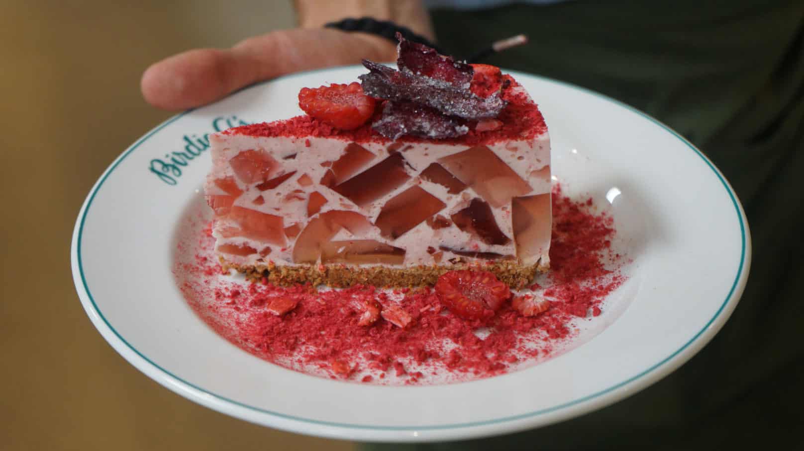 Holding a slice of Rose Petal Pie